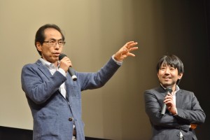 放送の２日後（29日）に三重県松阪市での講演でも報道ステーションについて話す古賀芳明氏（左）。隣は松阪市市長。（撮影／横田一）